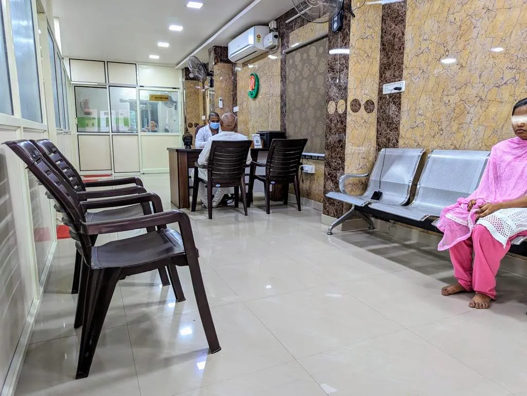 Interior clinic corridor with sanitized waiting chairs at Myla Dental Care Guntur