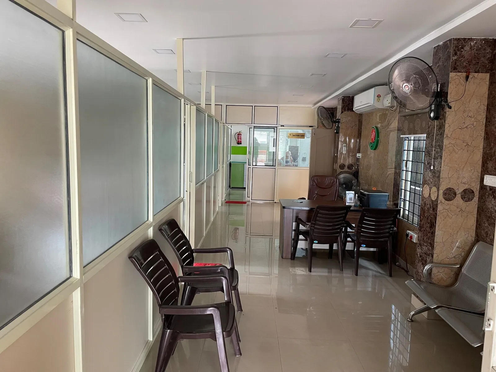 Polished clinic hallway with comfortable seating and treatment rooms at Myla Dental Care