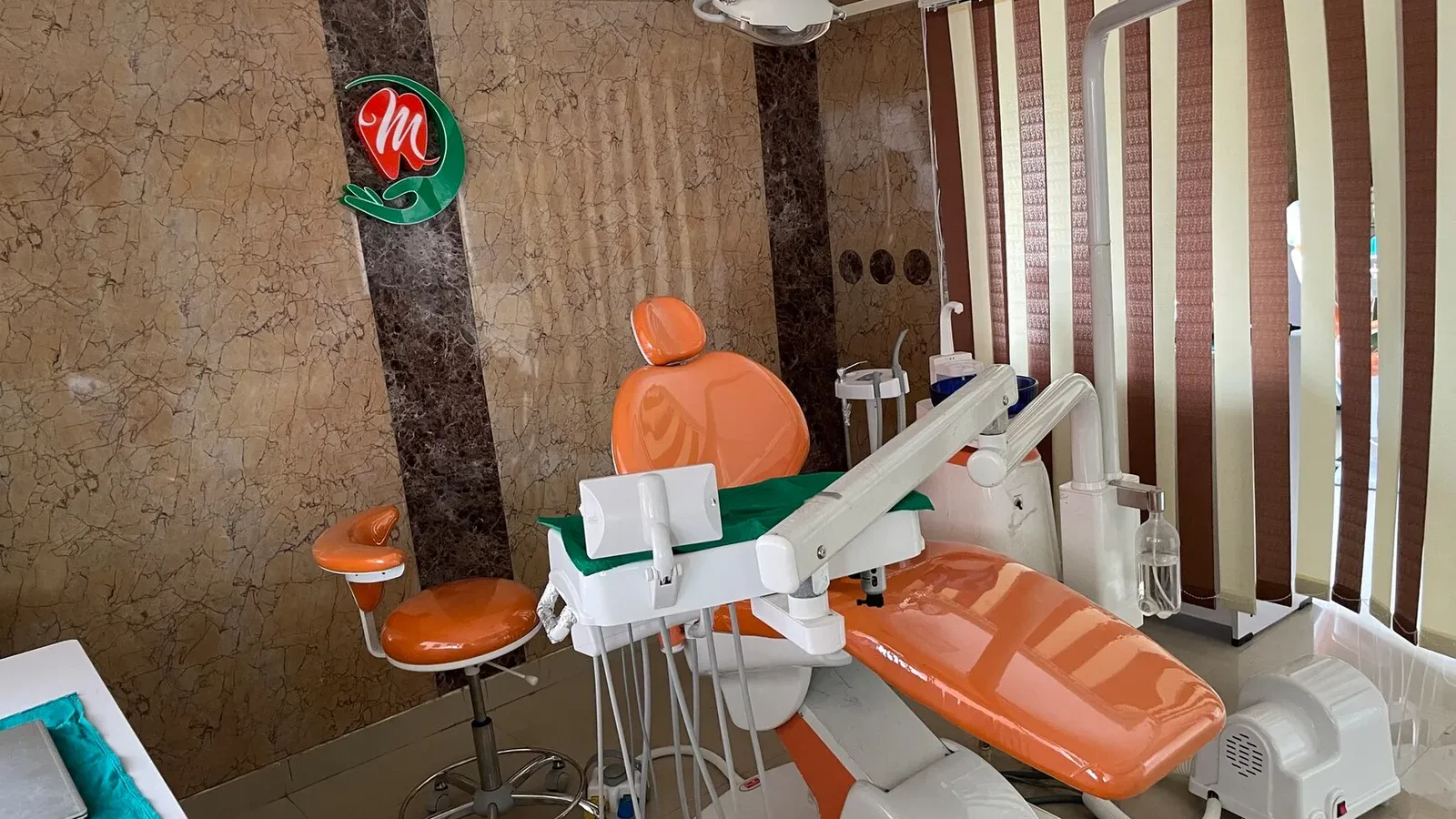 Modern Operatory Suite with Logo Wall at Myla Dental Care Guntur