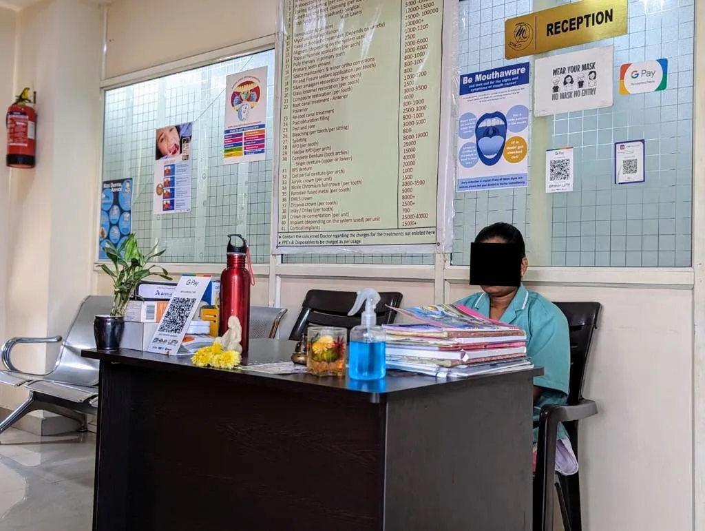 Front desk reception counter with professional certificates and patient guidance notices