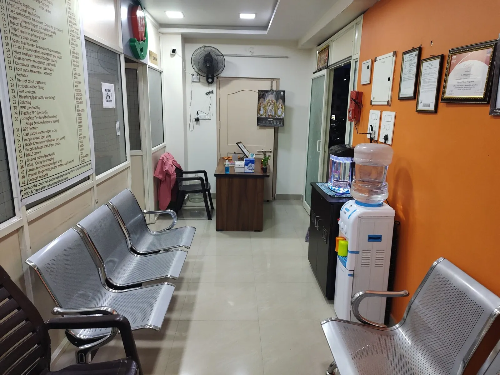Patient waiting area equipped with comfortable chairs and water dispenser at Myla Dental Care